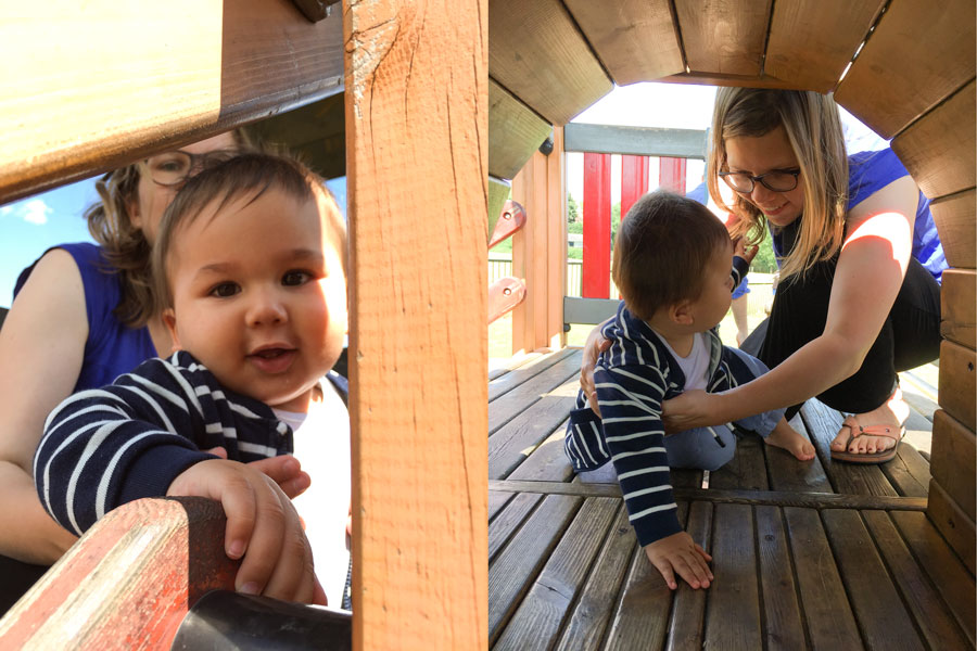 On a baby jungle gym with Mama